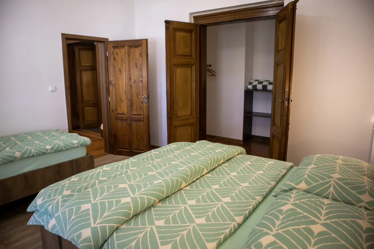 Bedroom with original wooden doors